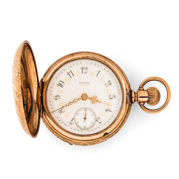 Front view of Elgin hunter-case pocket watch with opened cover displaying dial and ornate hands