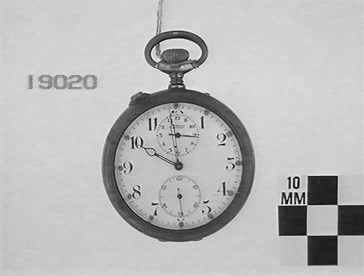 Front view of the Gubelin pocket watch showing the alarm dial at 12 o'clock and subsidiary seconds at 6 o'clock.