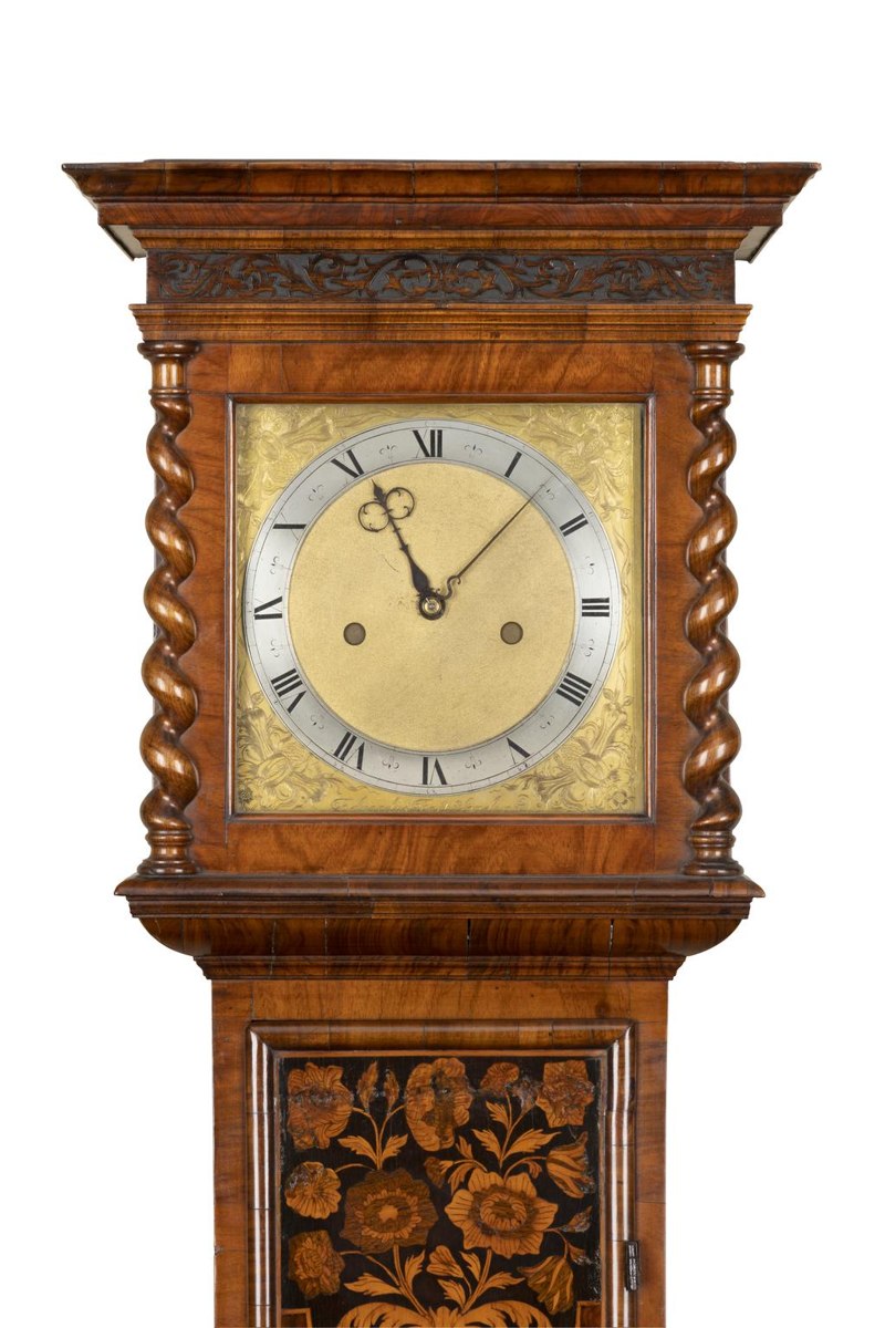 Hood and upper trunk of the eight-day longcase clock by Edward East in a floral marquetry case