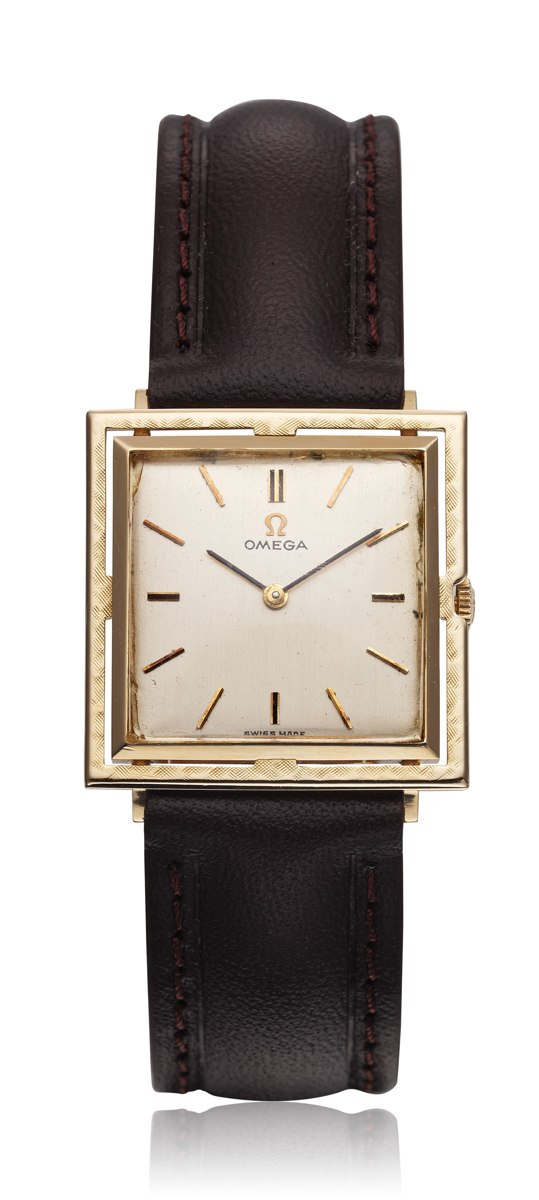 Front view of the Omega 14k gold square dress watch showing the floating frame, silvered dial, and leather strap