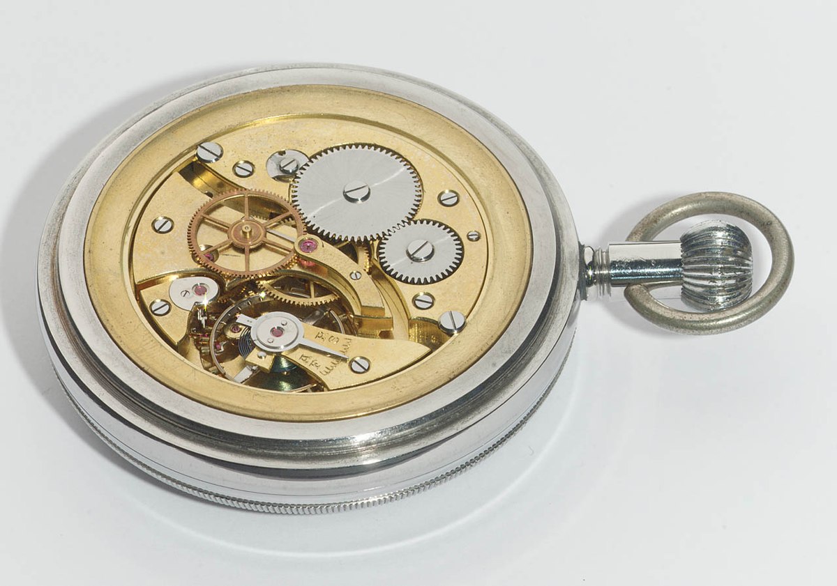 Three-quarter movement view of the uncased deck watch showing the train, balance, and regulator scale