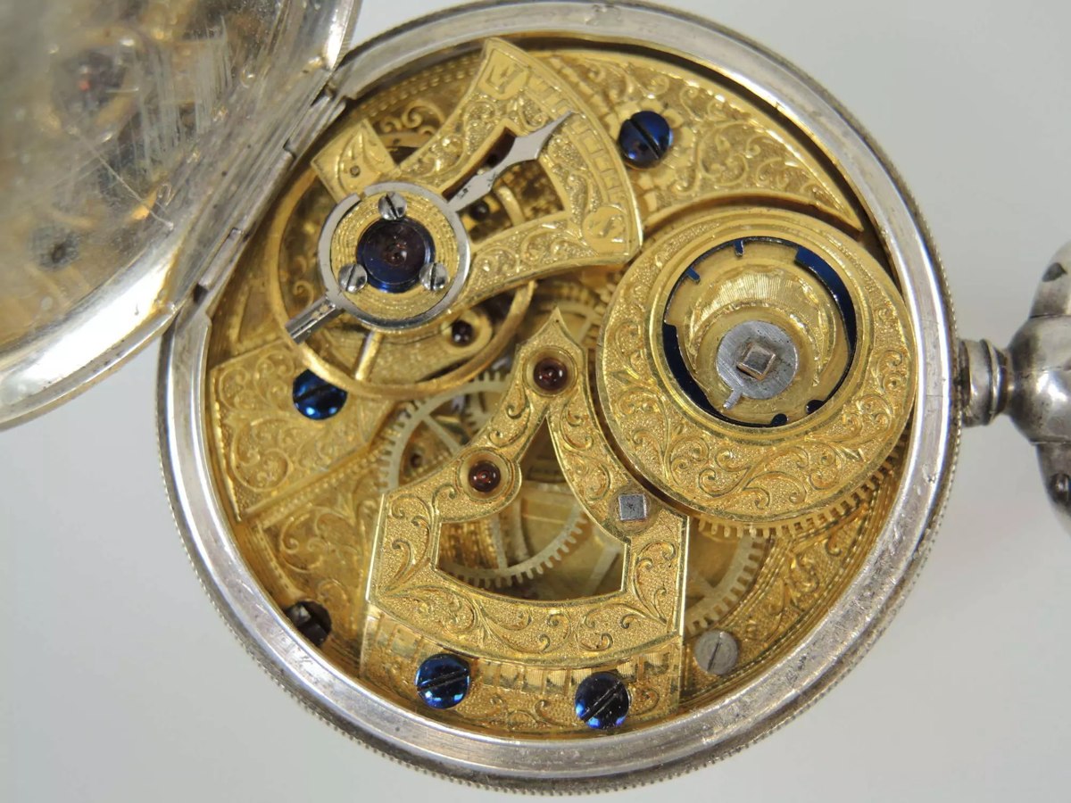 Movement view of the Chinese market duplex pocket watch showing engraved gilt bridges and balance cock