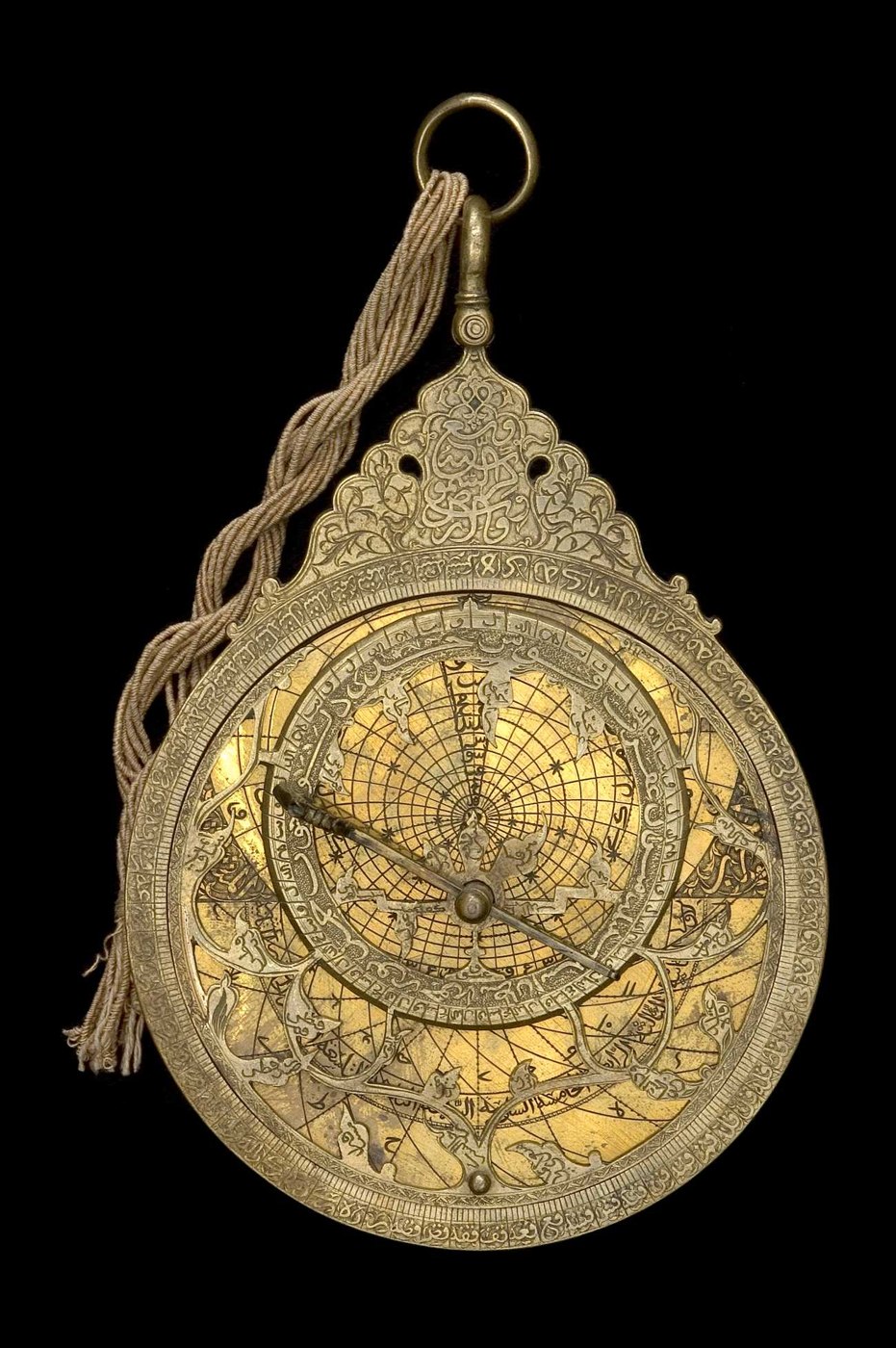 Front view of the brass astrolabe (inventory 45581) showing the rete, limb, and throne.
