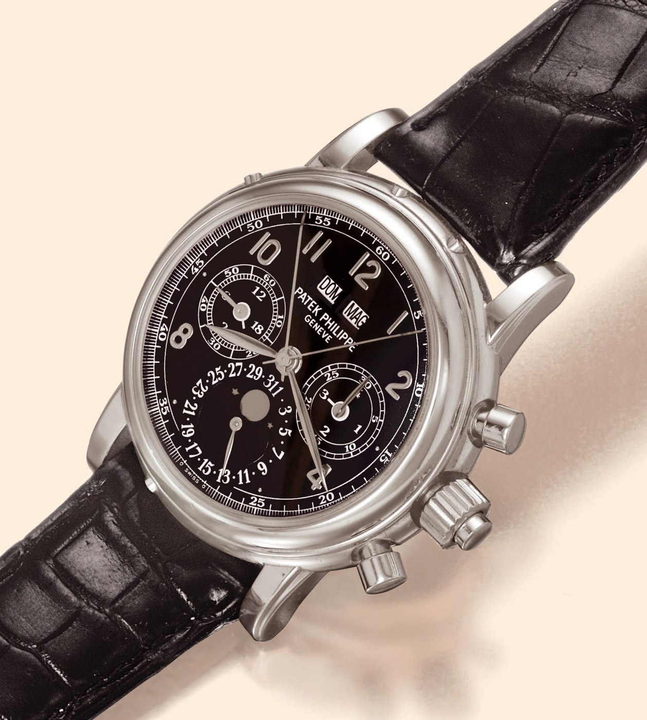 Front view of the Patek Philippe Ref. 5004P, showing the black dial, moon phase display, and chronograph registers.