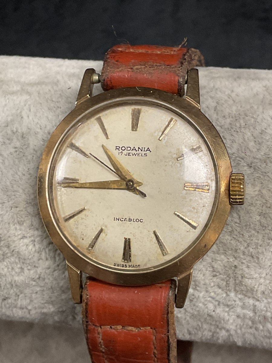 Front view of the Rodania 9ct gold wristwatch showing dial and leather strap