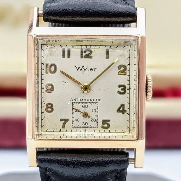 Front view of the square Wyler Antimagnetic wristwatch on a black strap
