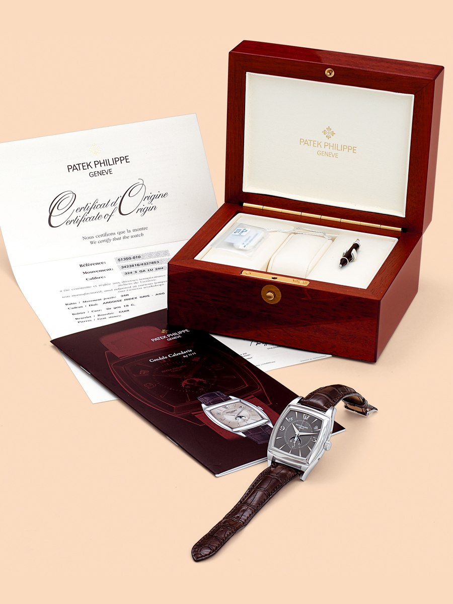 Patek Philippe Ref. 5135G with accompanying box, documentation, and accessories.
