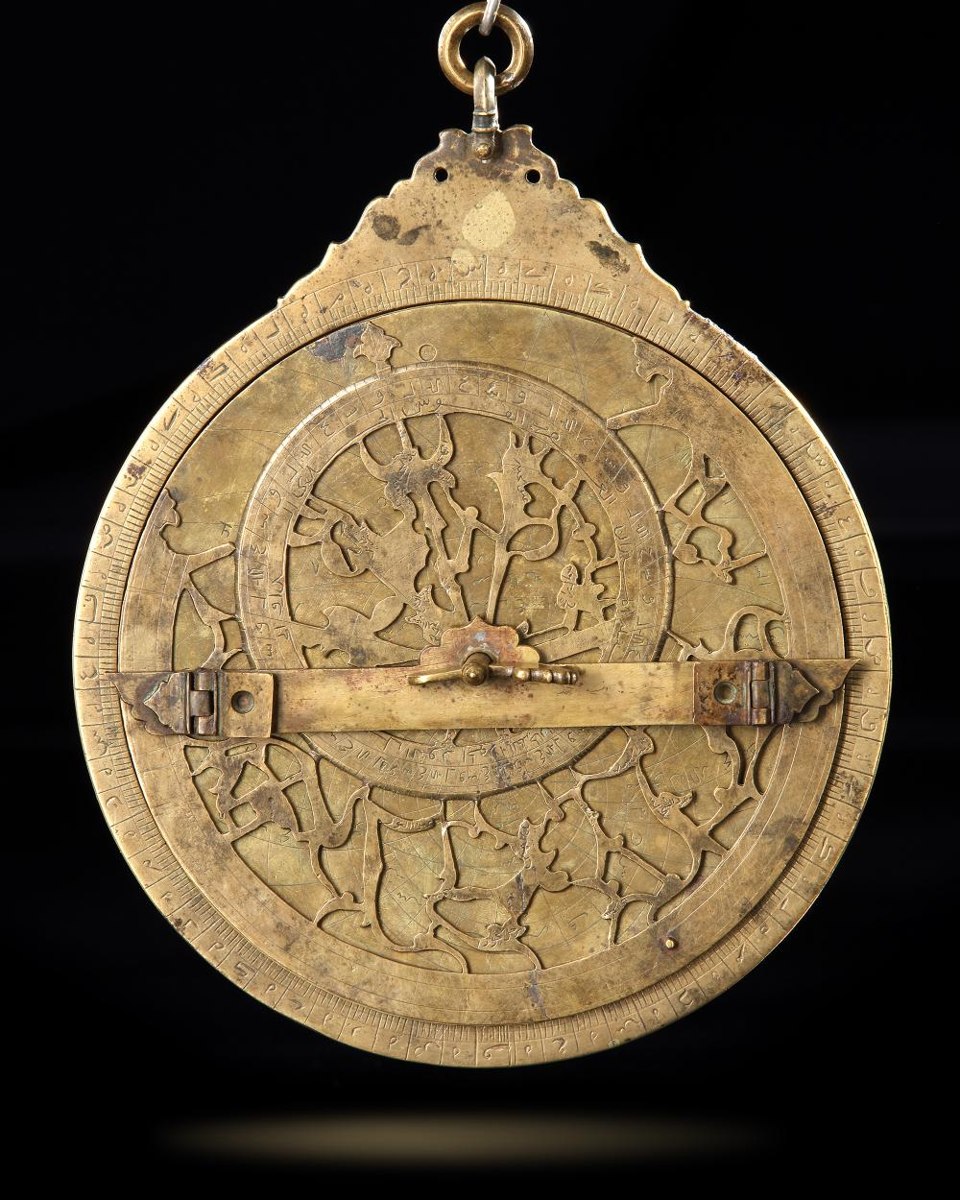 Front face of the brass astrolabe showing the suspension throne, rete, and horizontal rule