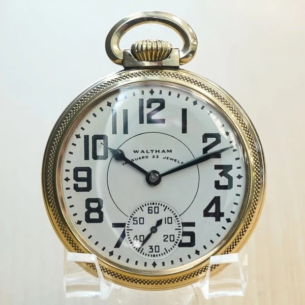 Front view of the Waltham Vanguard pocket watch showing dial, blued hands, and textured bezel