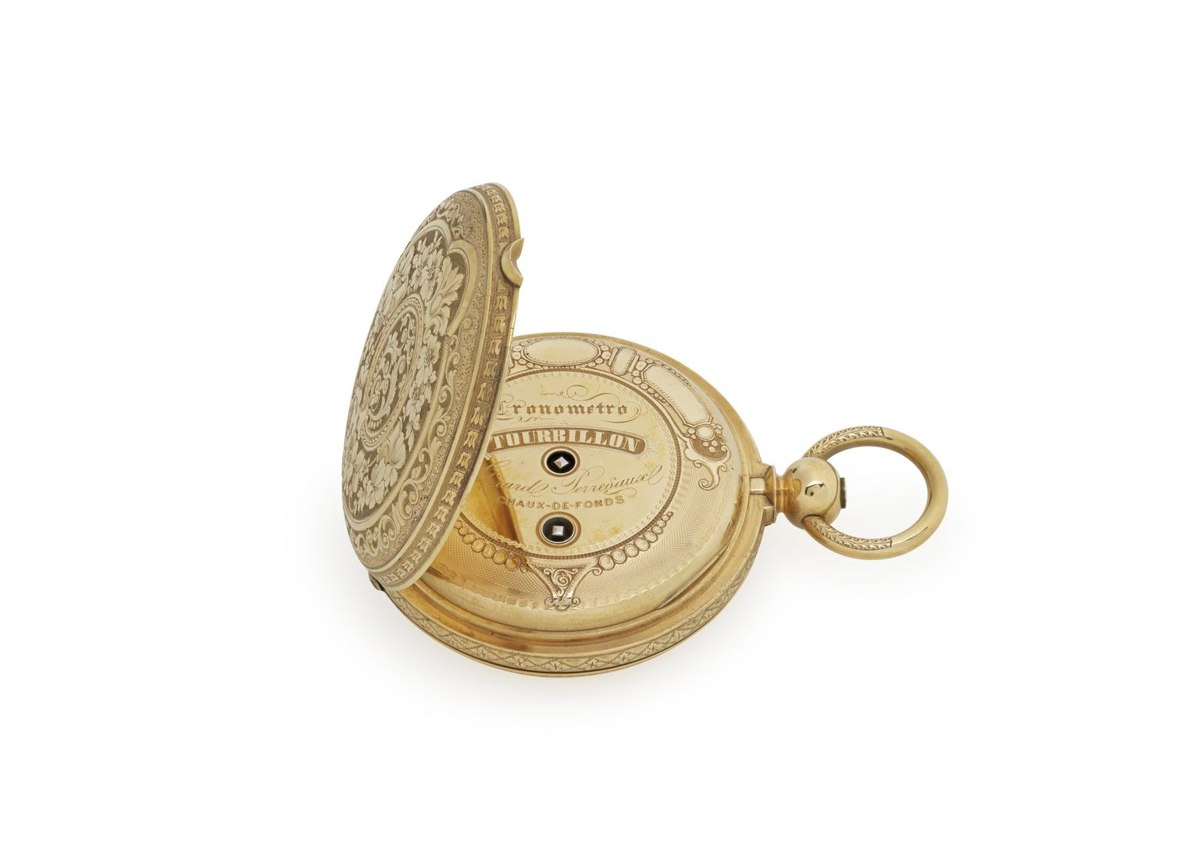 Three-quarter view of the engraved gold hunter case with outer lid open showing the inscribed cuvette