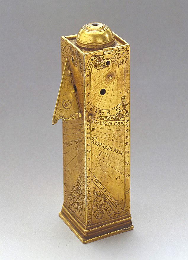 Gilt brass column sundial with a hinged lid containing a compass and a plumb-line mechanism for leveling.