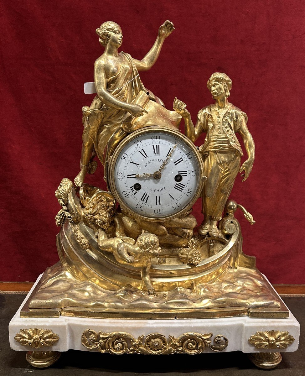 Front full view of the Louis XVI gilt-bronze and marble mantel clock depicting maritime commerce