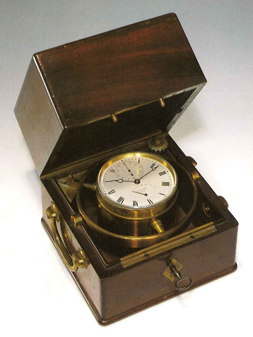 The Winnerl marine chronometer displayed within its mahogany box with the sliding lid removed.