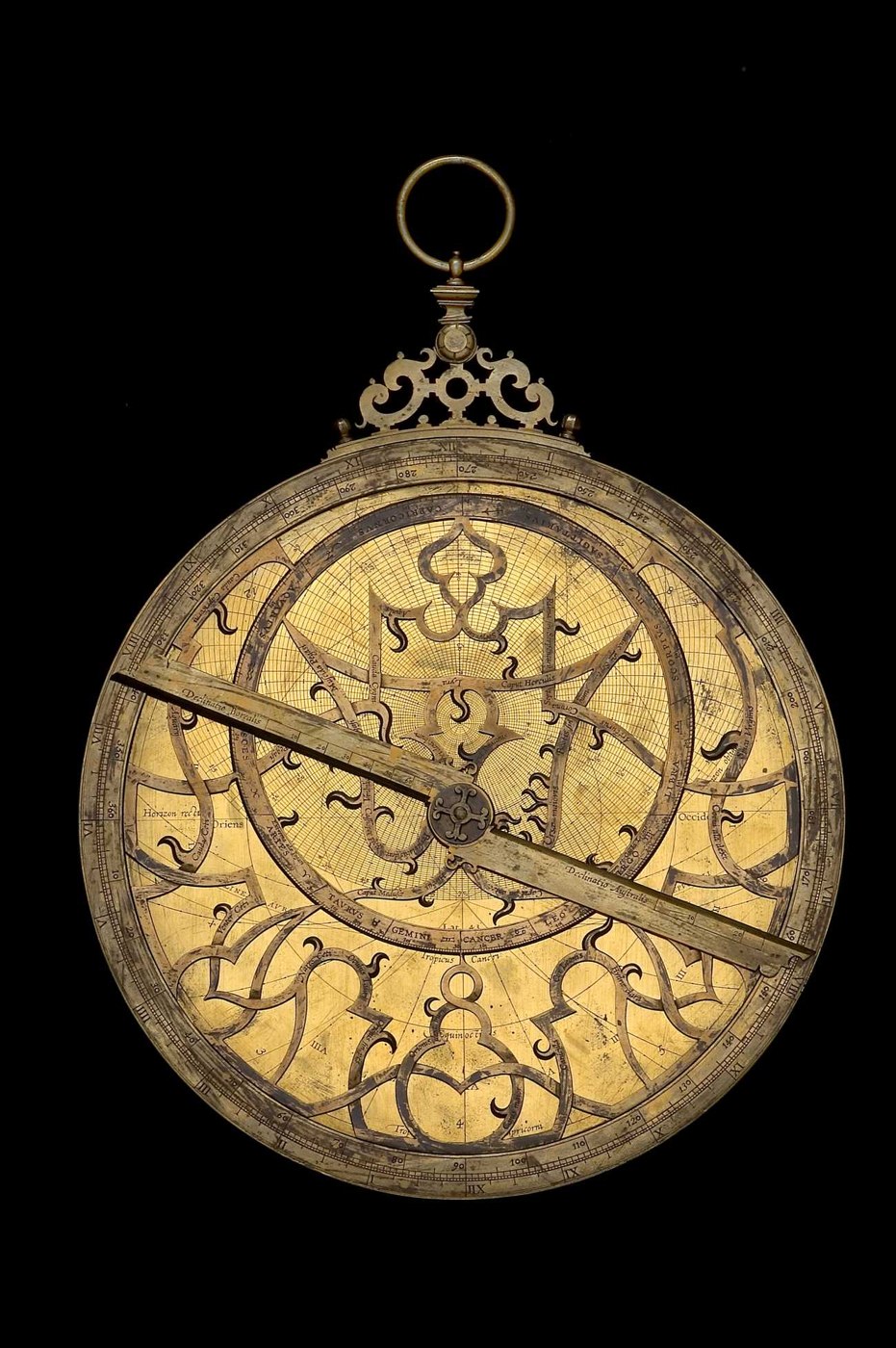 Full view of the astrolabe showing the rete, rule, and alidade.