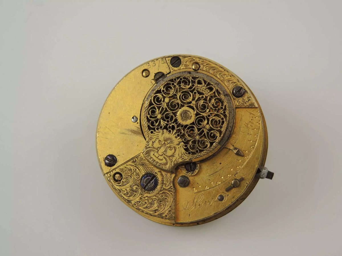Top plate view of the Georgian verge fusee pocket watch movement showing pierced balance cock and regulator scale