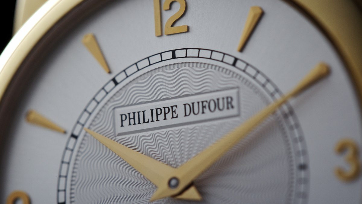 Dial detail of Philippe Dufour Simplicity number 14 featuring guilloché engraving and applied maker cartouche