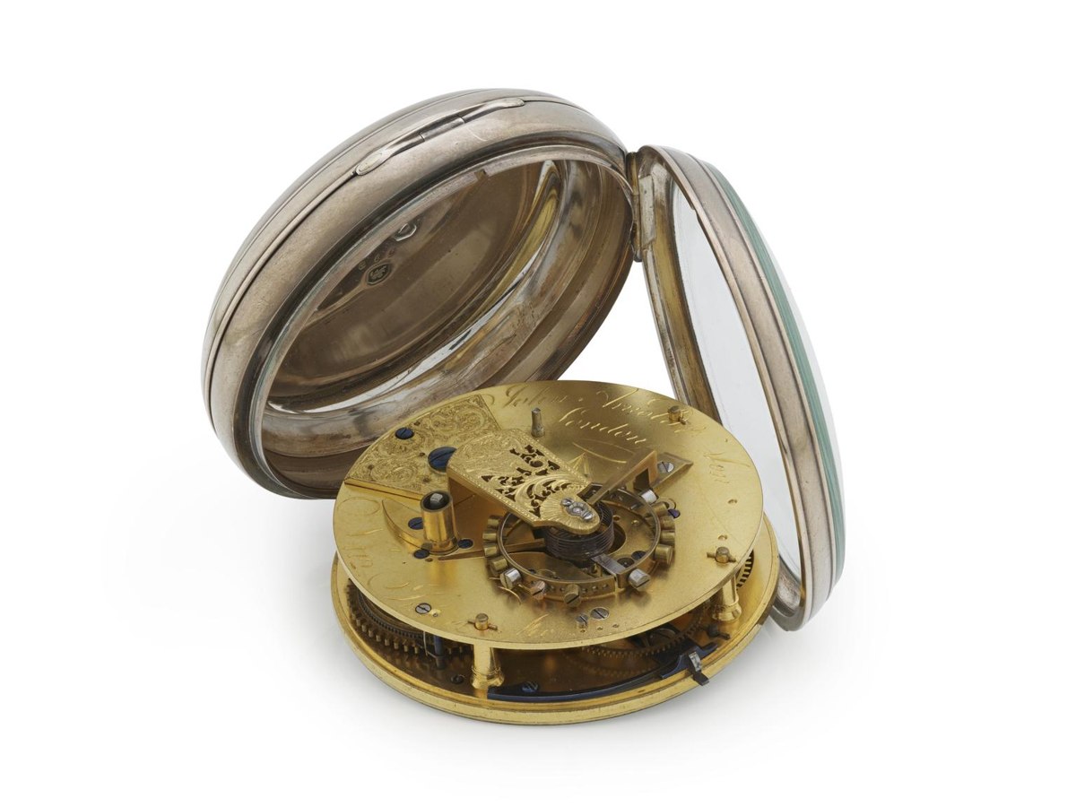 Movement view of John Arnold & Son deck watch No. 112 displayed in its opened silver case