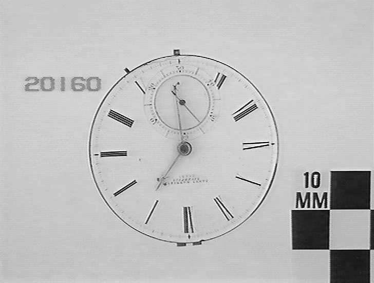 White enamel dial of the James Harrison pocket watch movement showing the subsidiary dial.