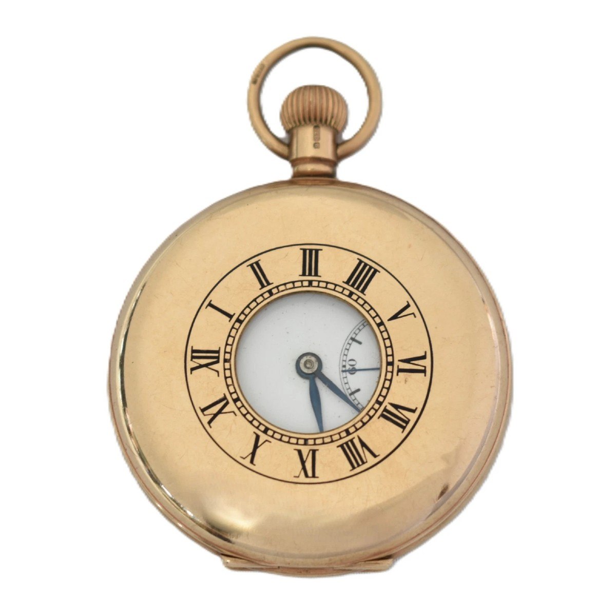 Front view of the closed 9ct gold half hunter pocket watch showing the glazed aperture and Roman numerals