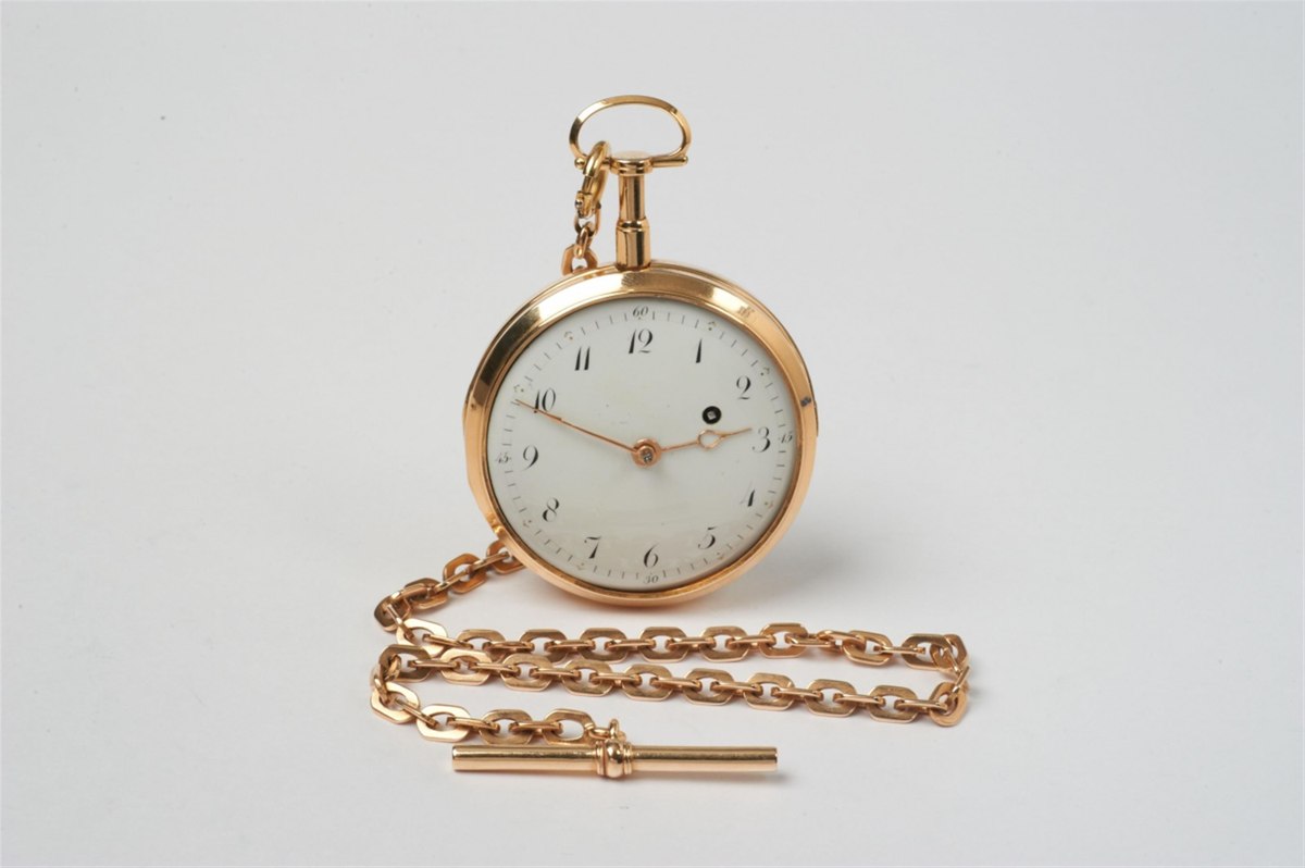 Dial view of the Charlemont openface repeating pocket watch shown with its attached gold chain