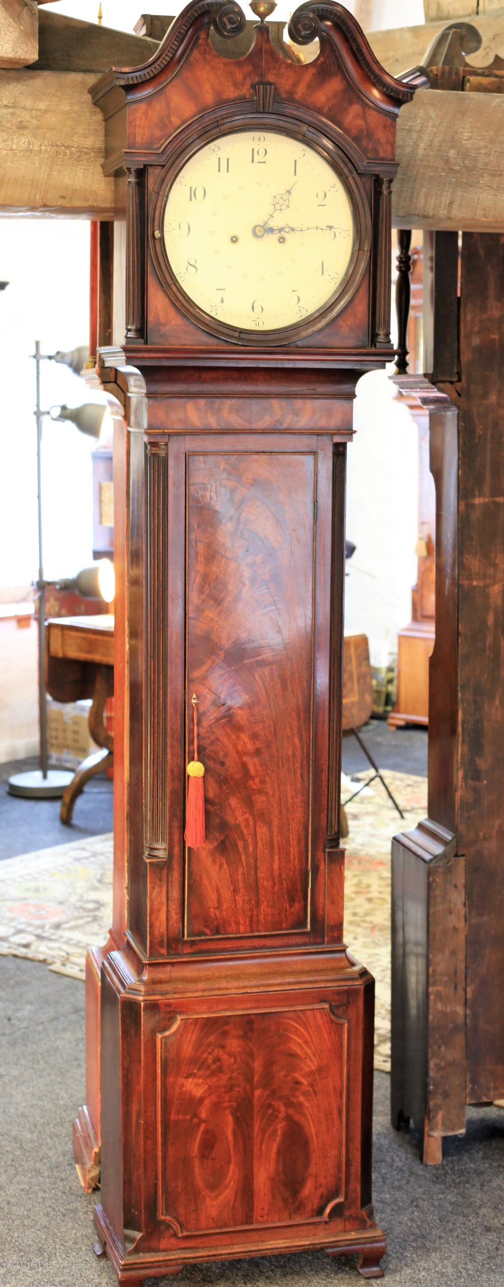 Full view of the mahogany longcase clock attributed to Samuel Deacon