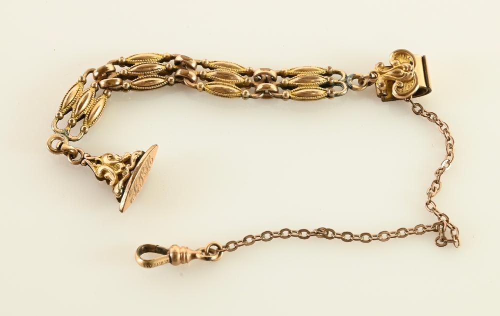 Antique pocket watch chain and fob with triple-strand links, fob pendant, clip, and stamped swivel clasp