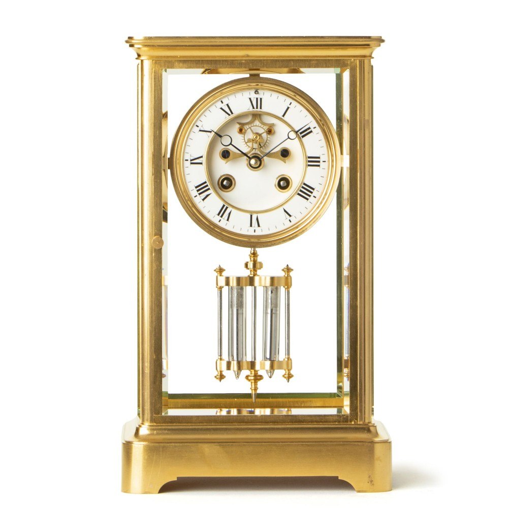 Front view of the gilded brass four-glass clock with exposed Brocot escapement and mercury pendulum