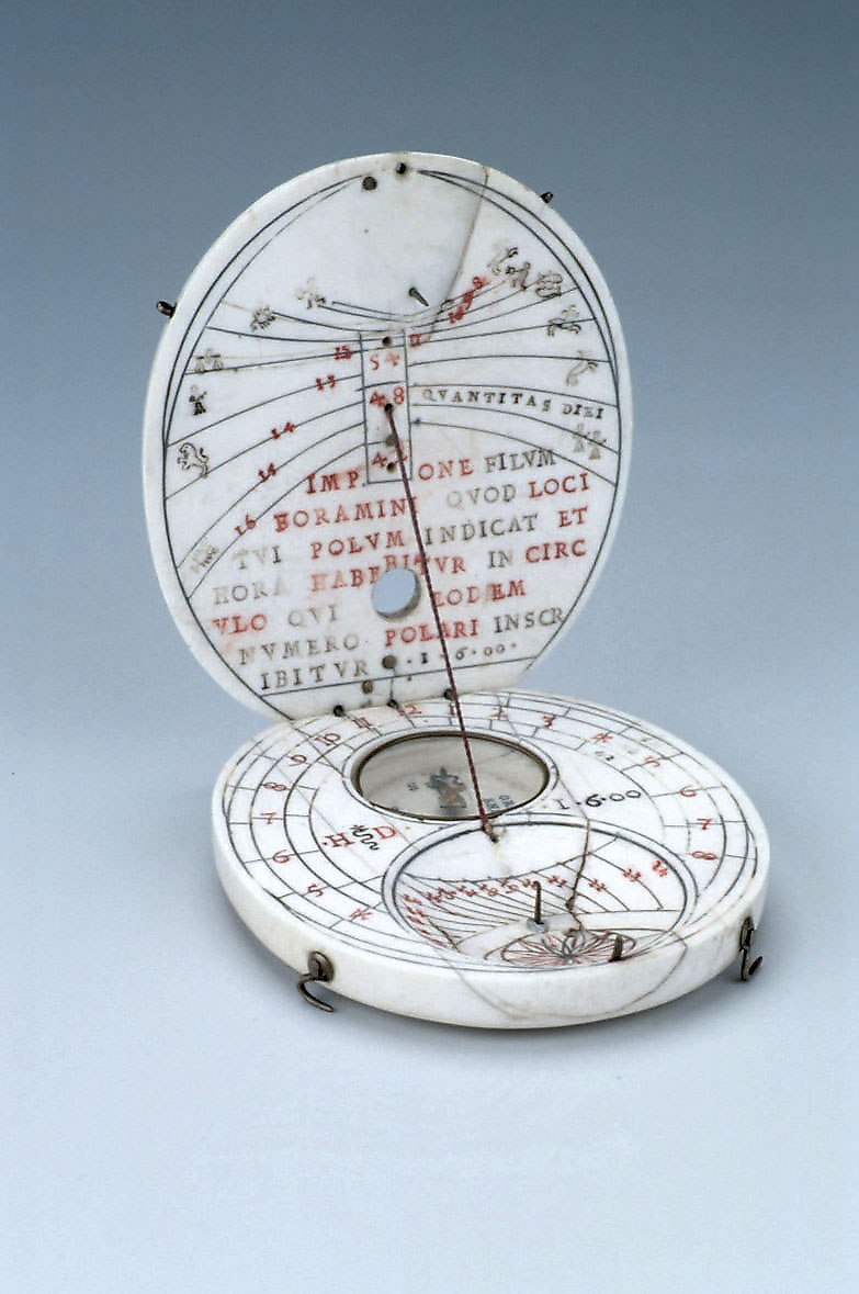 Diptych sundial, showing the interior of the opened leaves with gnomons, compass, and various hour scales.