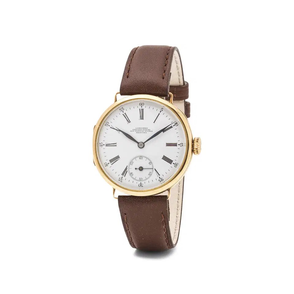 Front three-quarter view of the Longines 14K gold wristwatch showing the white retailer-signed dial and leather strap