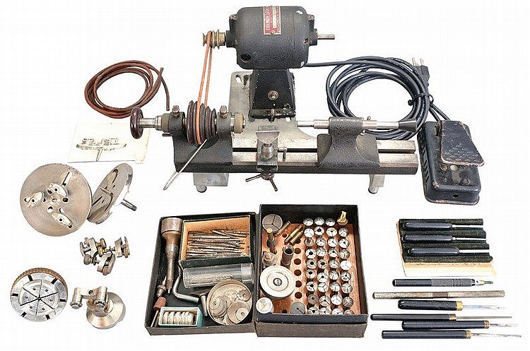 Derbyshire 8mm watchmaker's lathe setup with electric motor, foot pedal, and tooling accessories