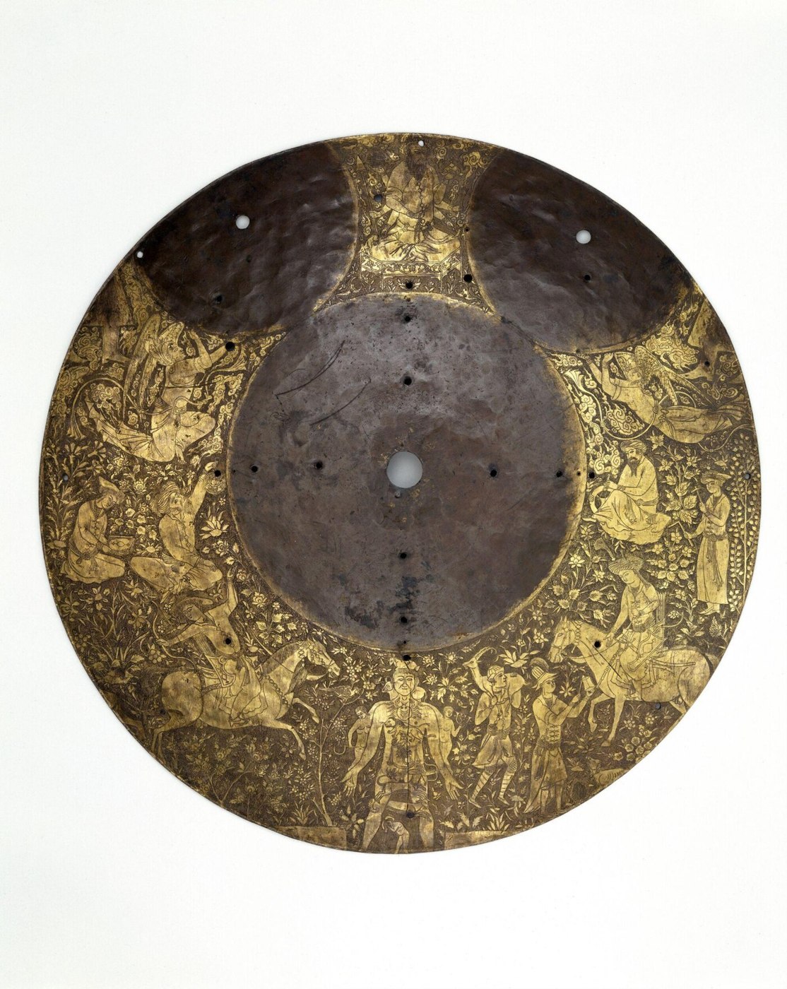 The copper disc, featuring the central blank dial space, the Saturn figure at the top, and various scholarly and courtly figures in the decorated registers.