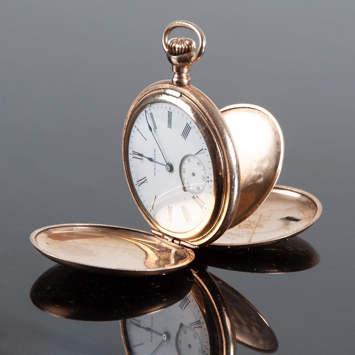 Opened Waltham 14K gold hunter case pocket watch showing dial, open covers, and cuvette