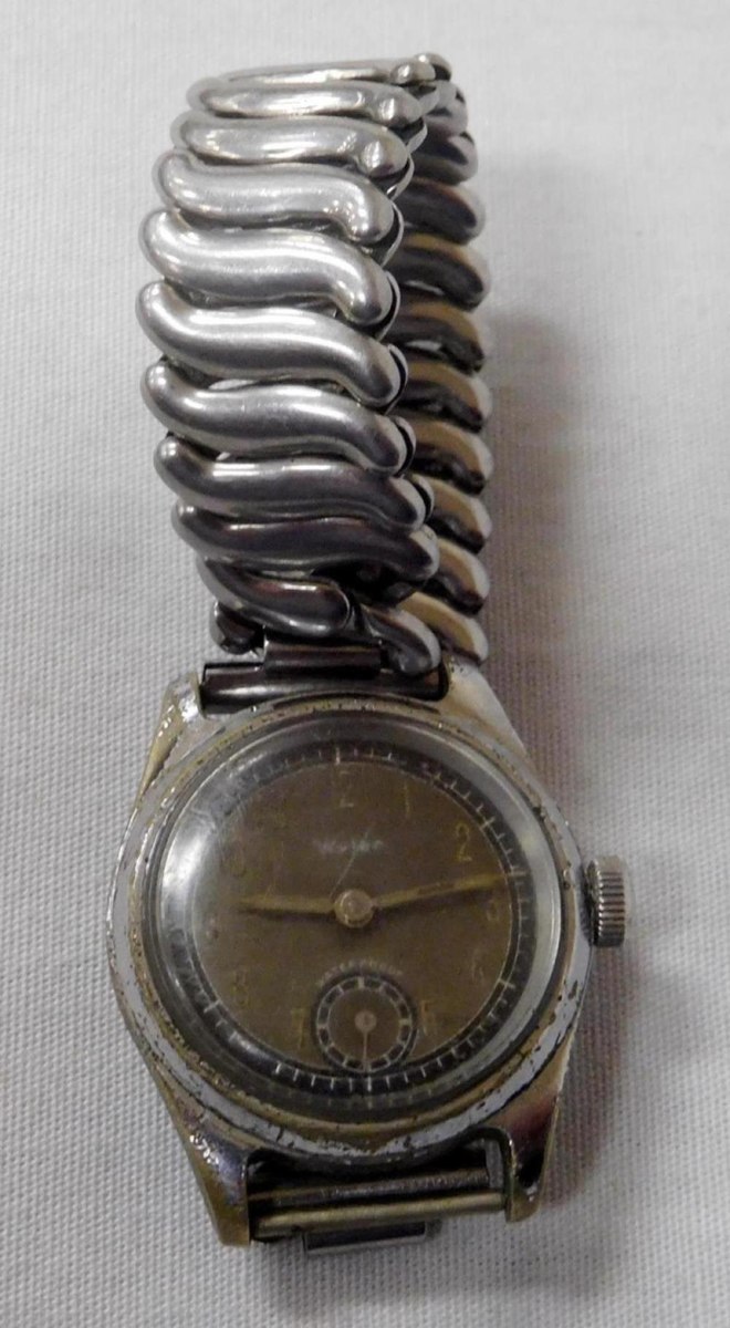 Front view of Wyler wristwatch with expansion band, subsidiary seconds dial, and aged case finish