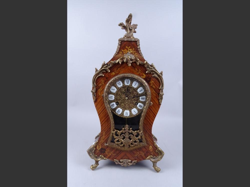 Front view of the marquetry and gilt bronze cartel clock