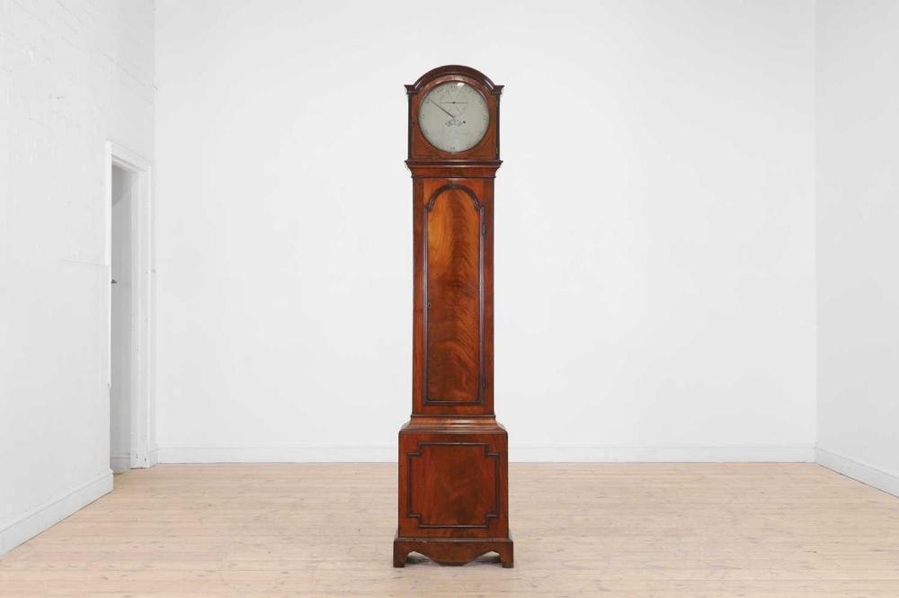 A Victorian mahogany longcase regulator clock by G J Wagstaff, shown in its entirety.