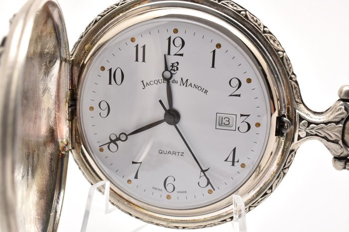 Dial and open hunter case of the Jacques du Manoir pocket watch