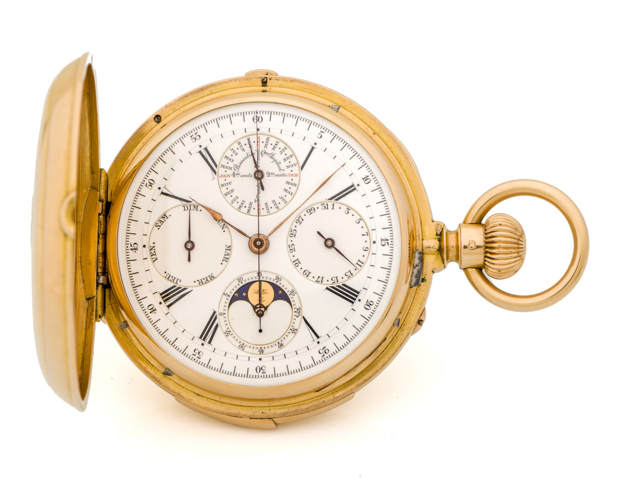 Front view of the pocket watch with hinged cover open showing the white enamel dial and calendar subdials