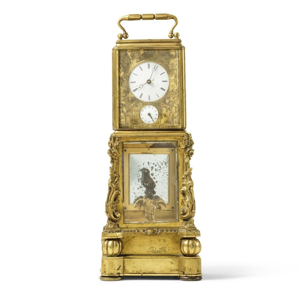 Front view of the French carriage clock featuring the upper timekeeping dial and lower automata bird display.