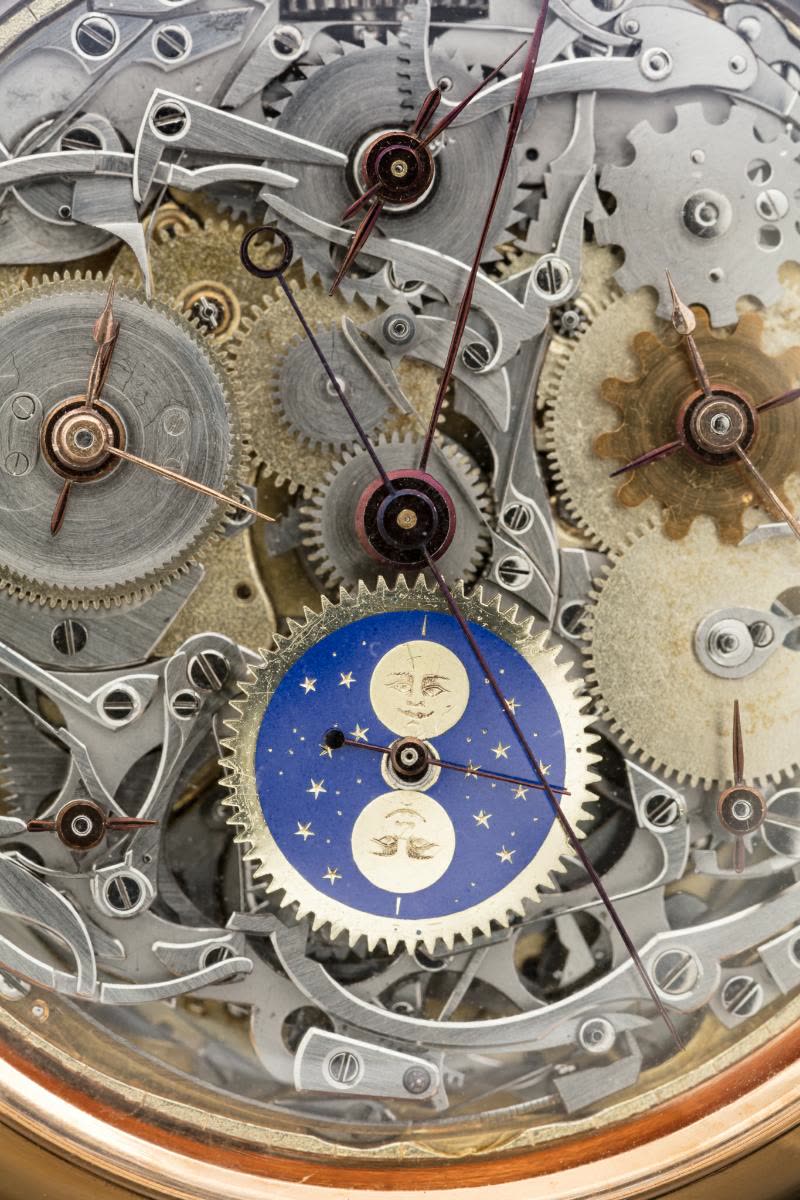 The polished gold case has several pushpieces and slides for operating a number of specific functions (MIH I-501)