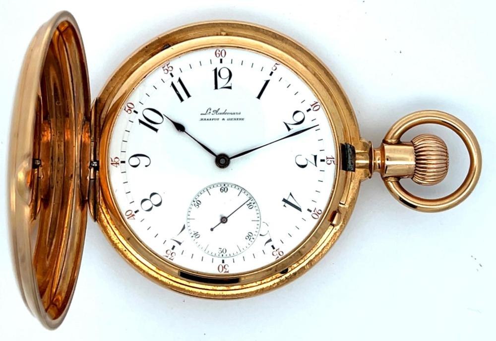 Front view of the Louis Audemars 14K gold hunting case pocket watch with the front cover open, displaying the white enamel dial and Arabic numerals.