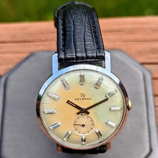 Front view of the Helbros wristwatch showing the patinated dial with faceted indices and sub-seconds register