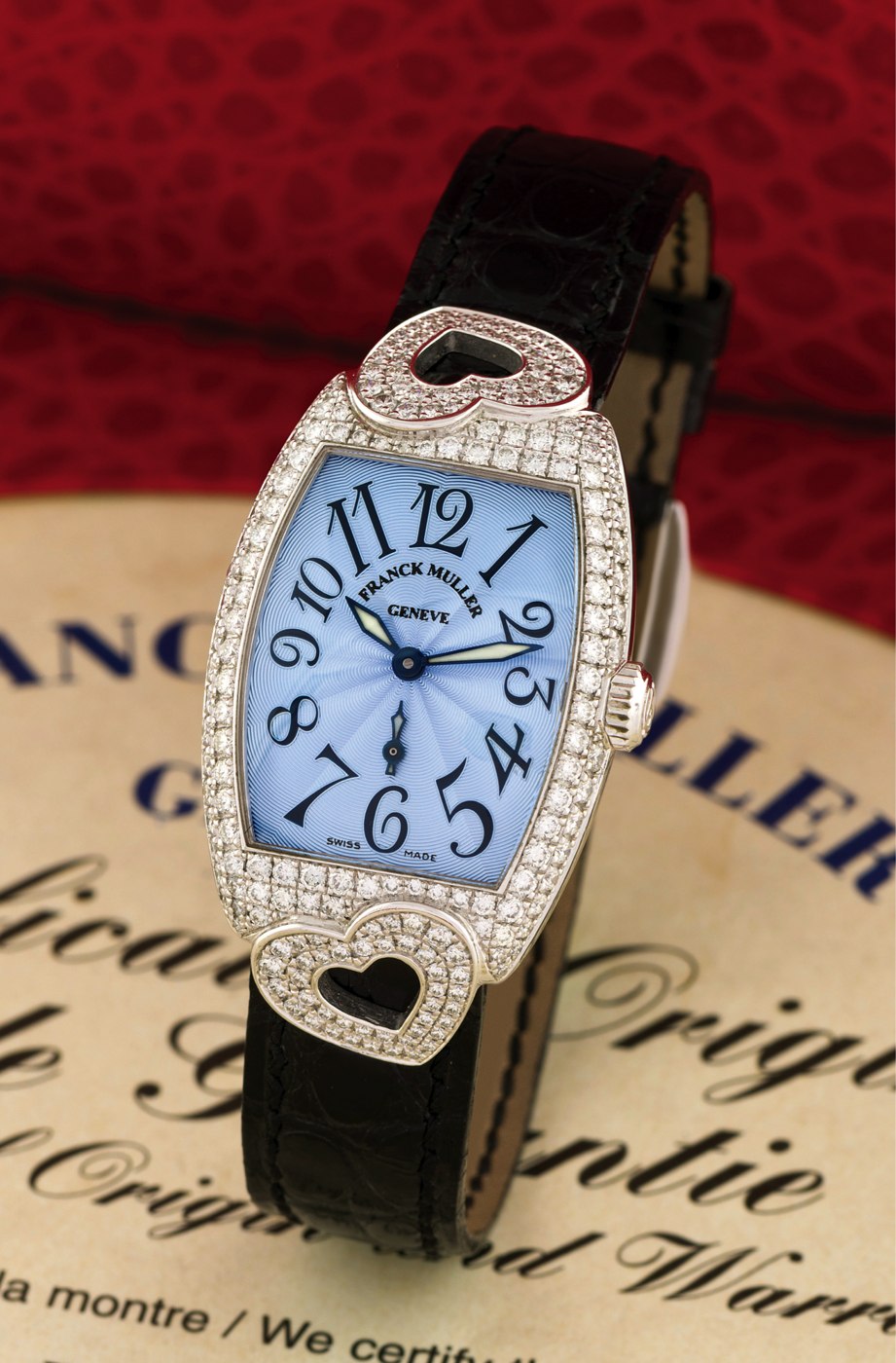 Front view of the Franck Muller Cintrée Curvex Heart wristwatch, showing the blue guilloché dial and diamond-set heart-shaped lugs.