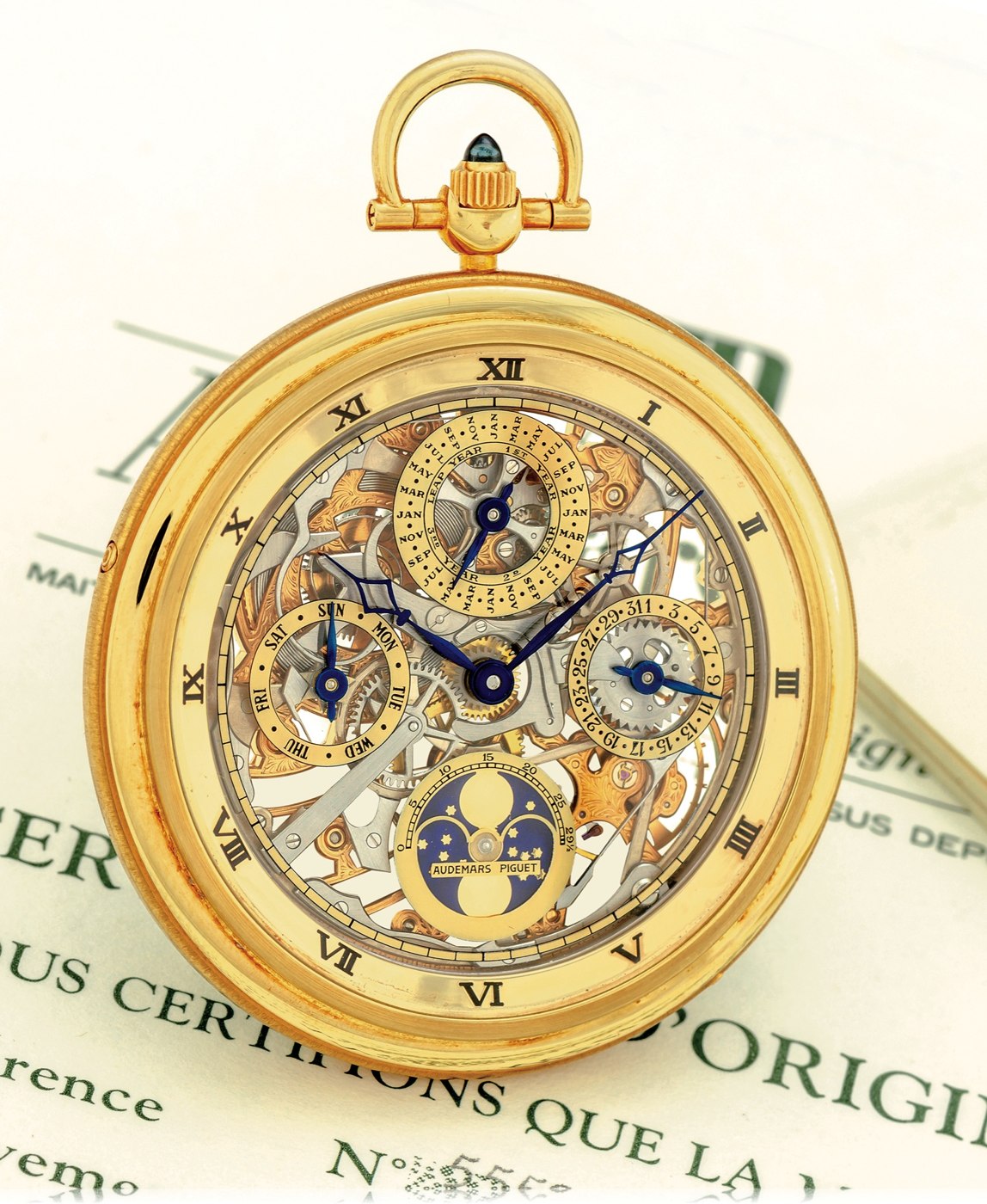 Front view of the Audemars Piguet Ref. 5559 pocket watch showing the skeletonized movement, perpetual calendar subsidiary dials, and moon phase aperture.