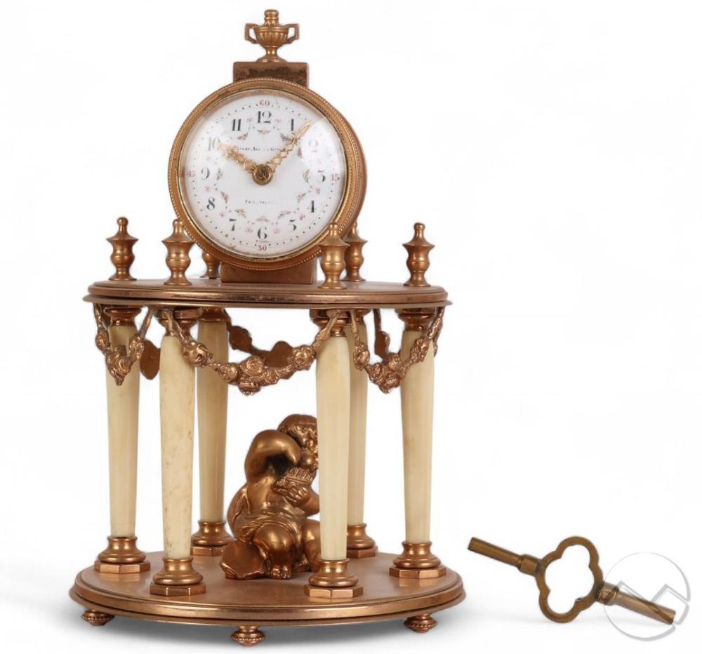 Louis XVI style gilt bronze mantle clock with winding key.