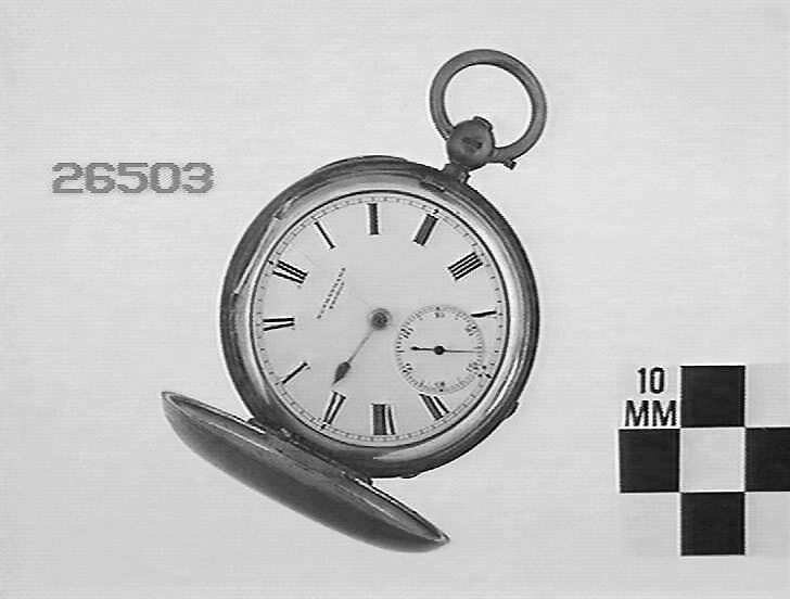 A silver hunter pocket watch by Rotherhams, London, showing the white dial with Roman numerals, subsidiary seconds, and the 12 o'clock pendant.