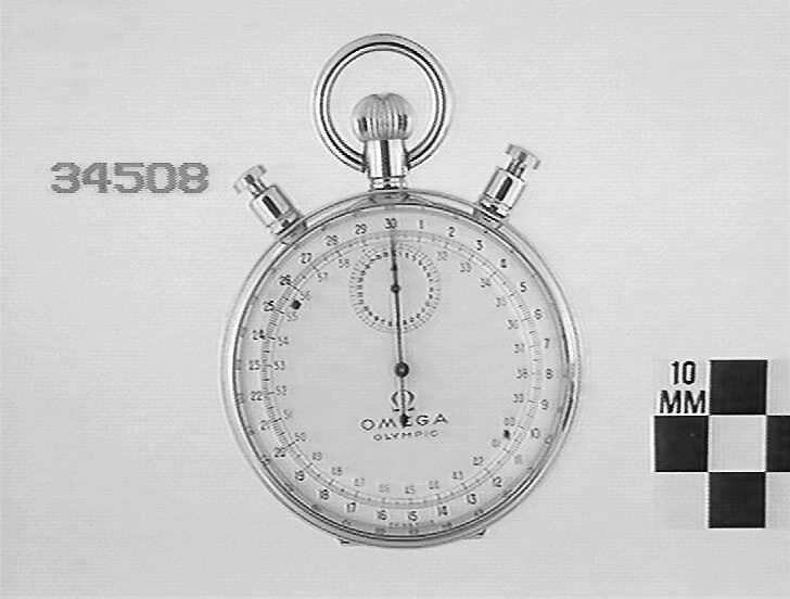 Front view of the Omega Olympic stopwatch showing the dual button configuration and dual-scale dial.