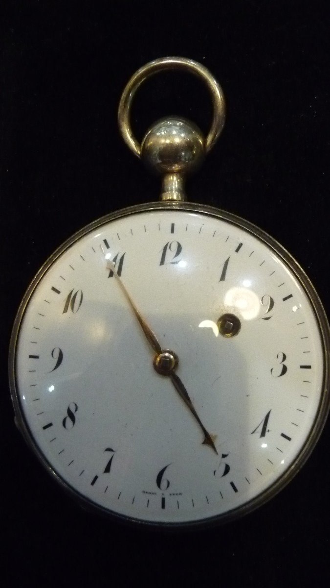 Dial view of First Empire pocket watch attributed to Reyst in Lyon, showing Arabic numerals and winding aperture