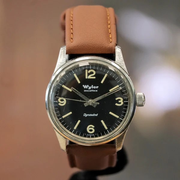 Wyler Incaflex Dynawind Lifeguard wristwatch with black dial on brown leather strap
