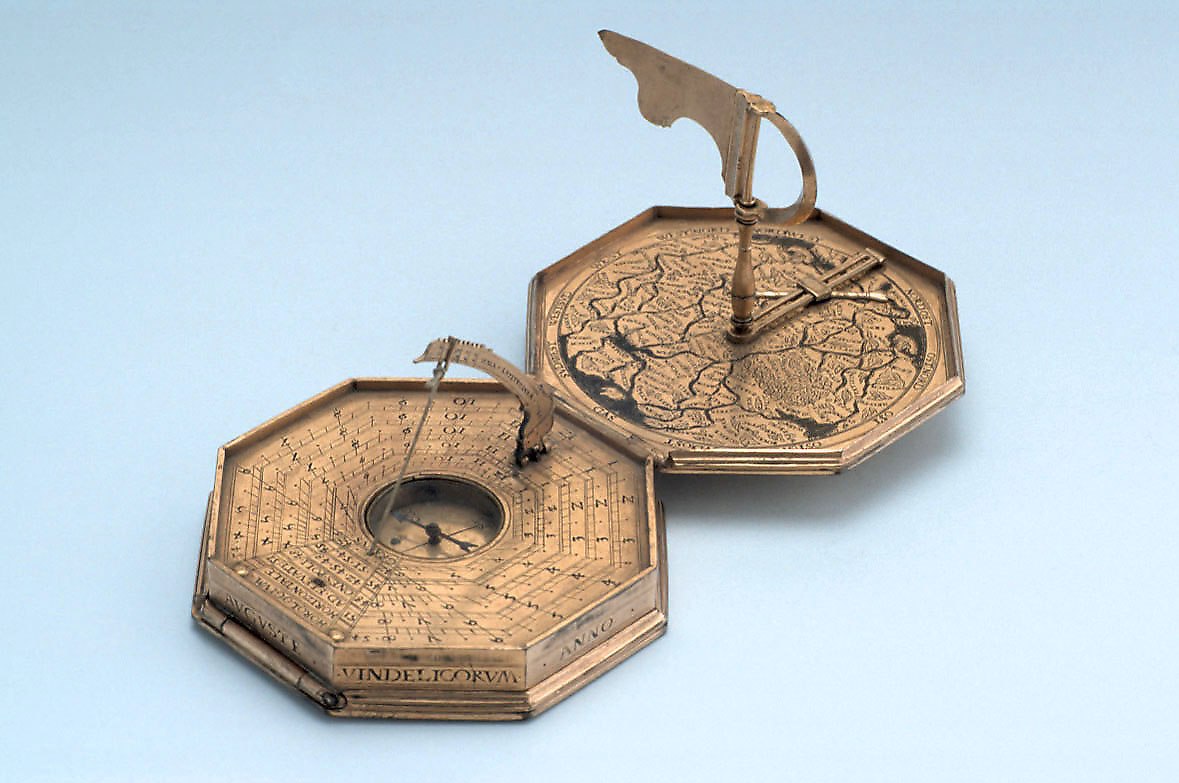 The internal layout of the Schissler astronomical compendium showing the horizontal string-gnomon dial with compass and the interior map of central Europe.
