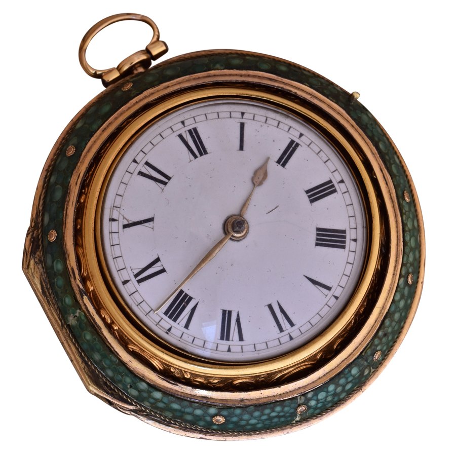 Front view of the pocket watch enclosed in its green shagreen piqué outer case showing dial and hands